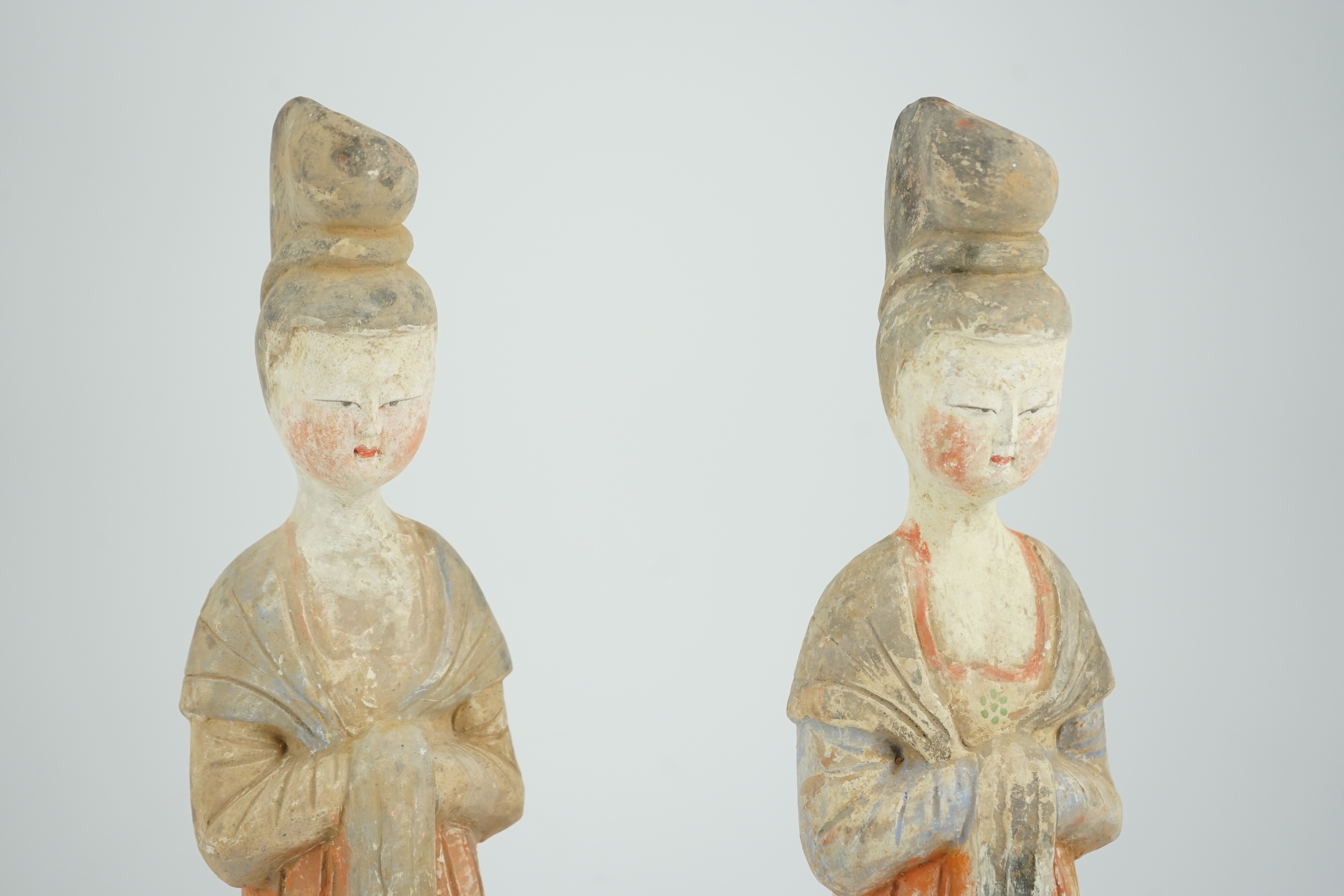 A pair of Chinese Tang style painted pottery ladies, 44.5cm